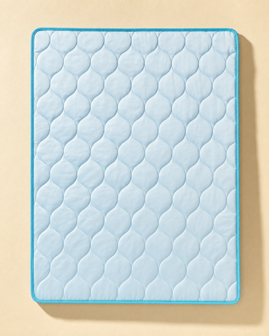 The PawFresco ChillMat laid flat — quilted ice-silk top with cyan bound edge, whole mat visible